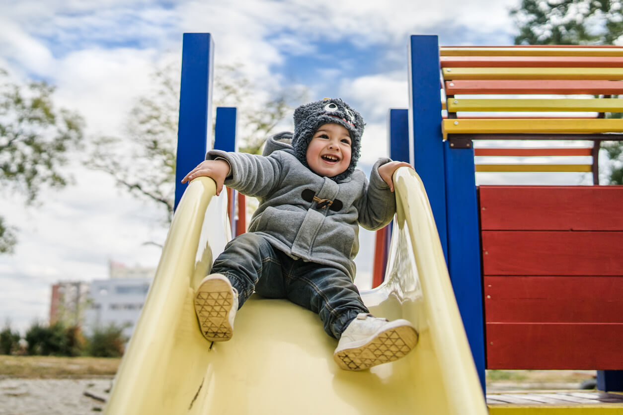 little boy on slide