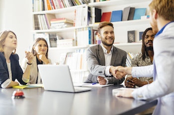 Group of Marketers Shaking Hands