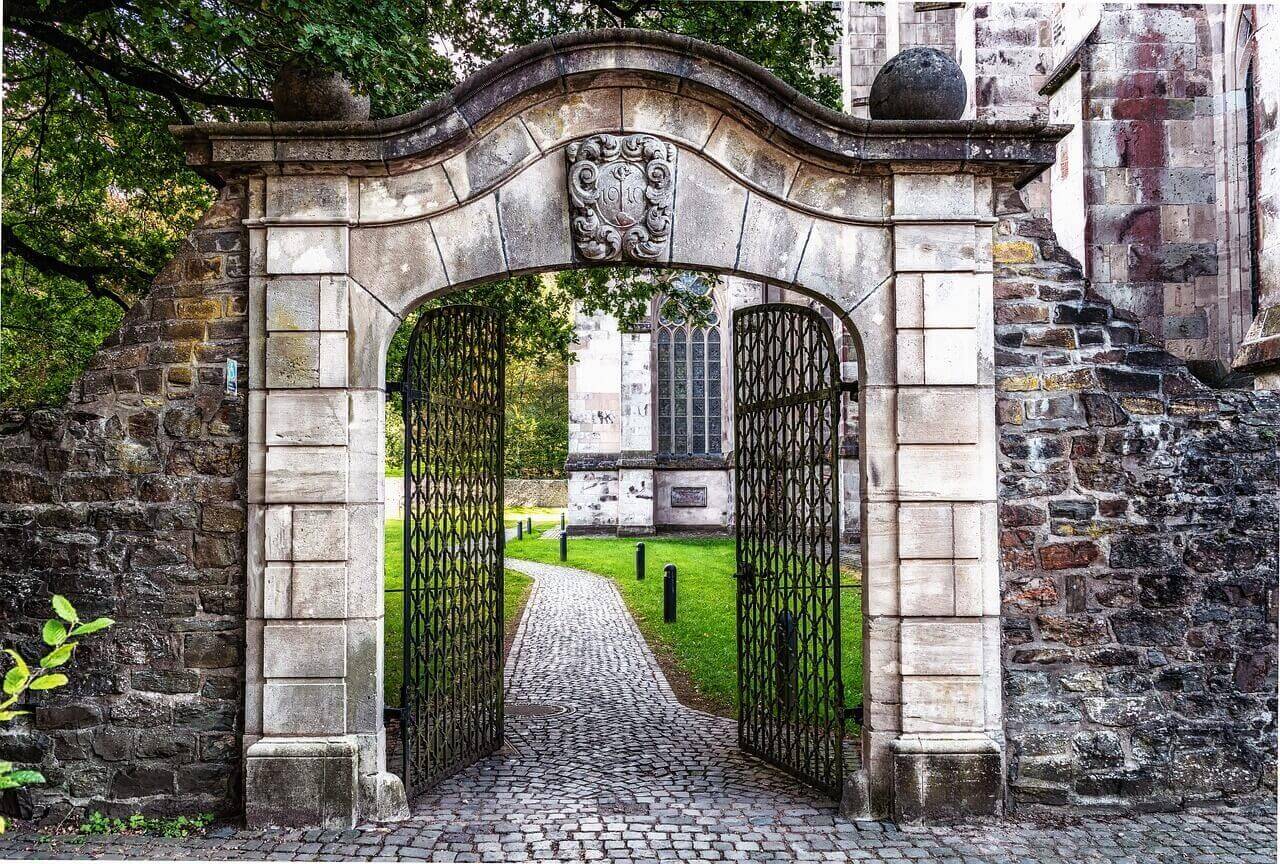 stone gate open to path