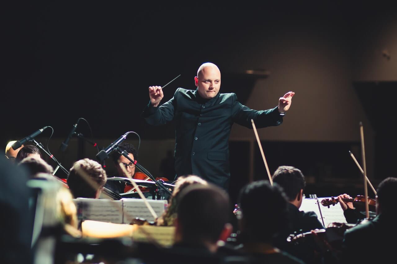 Conductor directing an orchestra