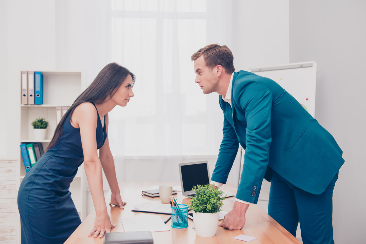 two angry colleagues over desk