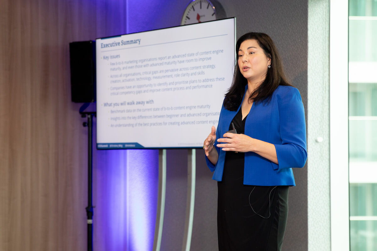 SummitEurope woman in blue blazer giving presentation