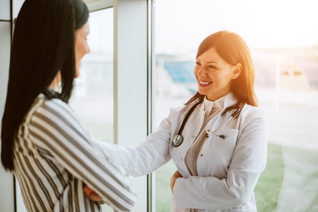 woman doctor smiling at patient