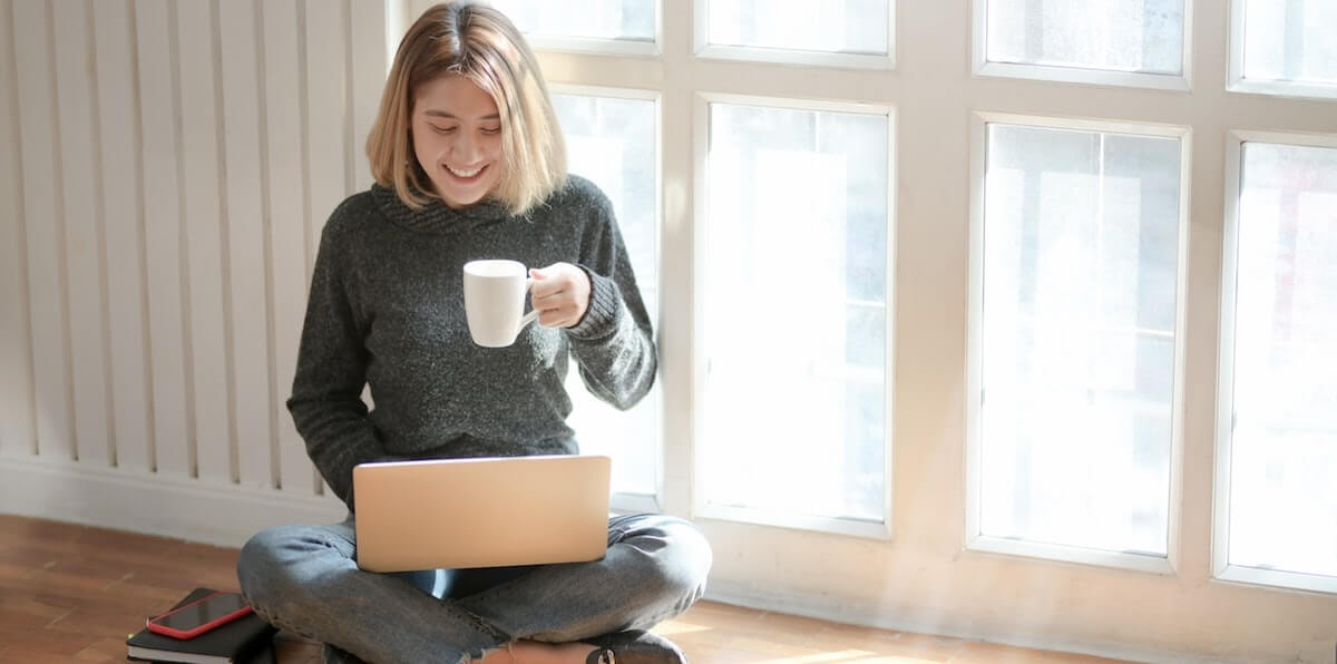 woman in gray sweater drinking coffee 3759089 2