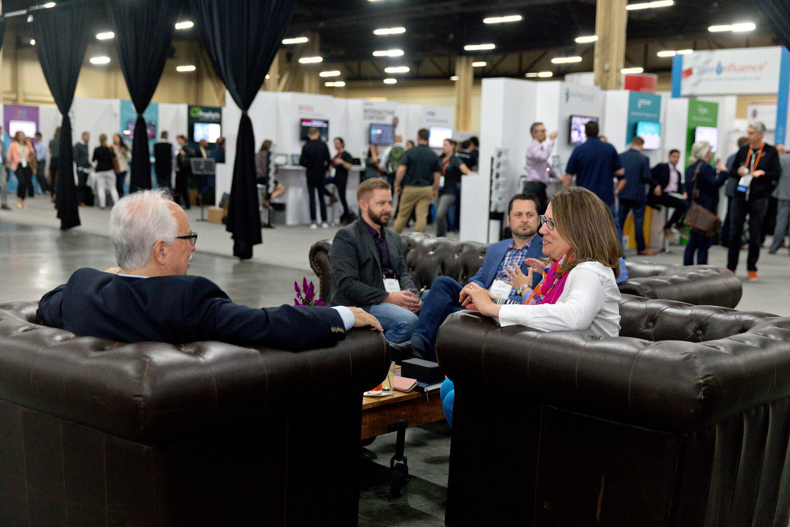 Summit attendees visiting the Marketplace