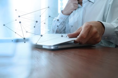 Laptop-on-desk-with-connected-dots