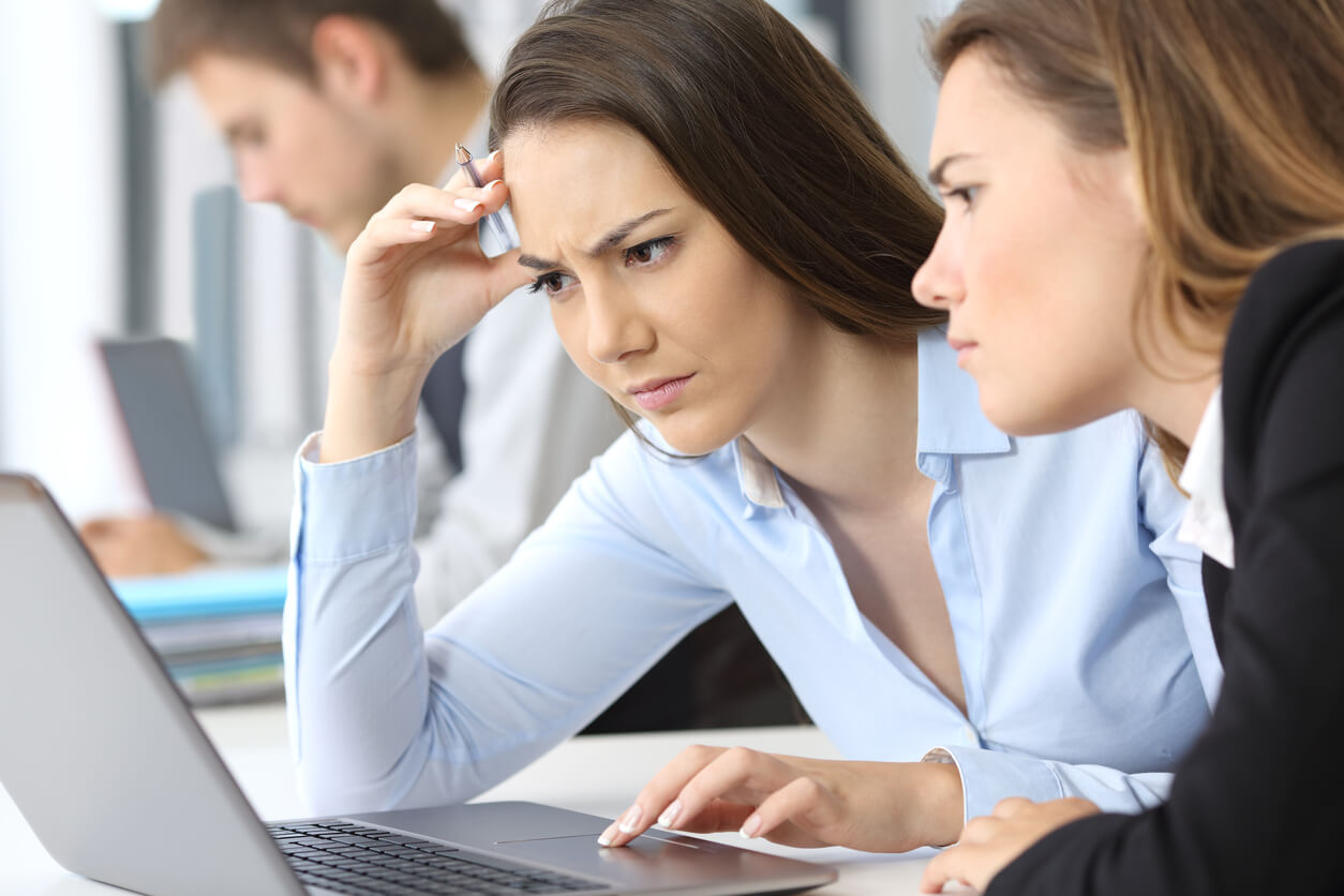 concerned women focused on laptop