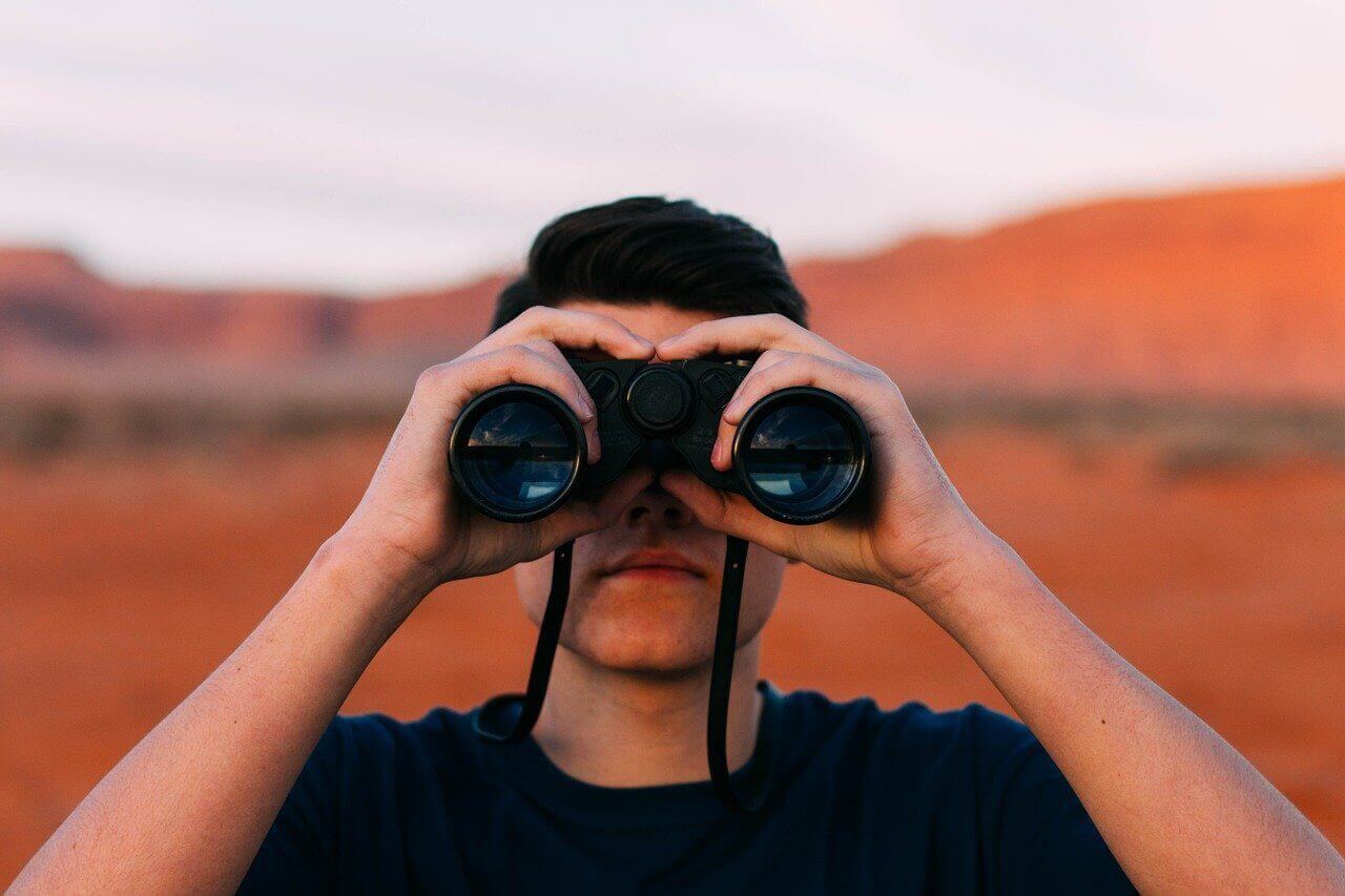 man with binoculars