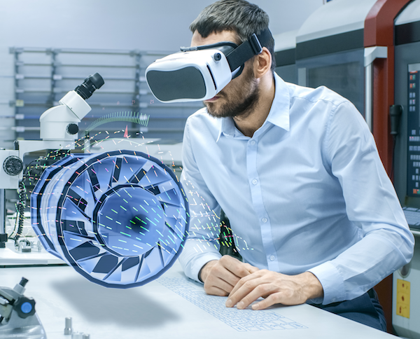 Man studying a virtual jet engine through VR glasses