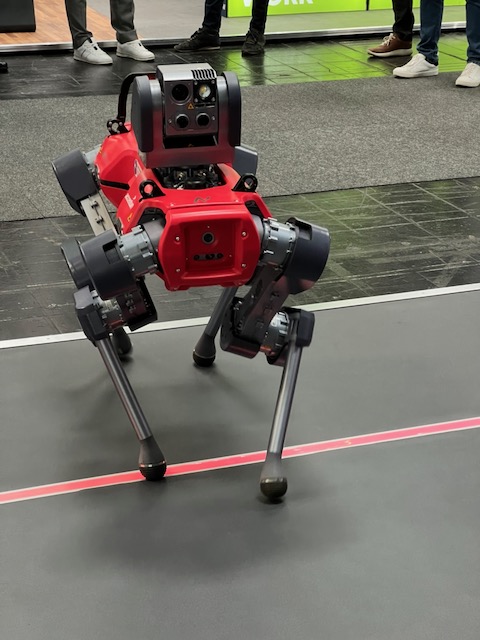 A robotic dog on a vendor's stand at Hannover Messe