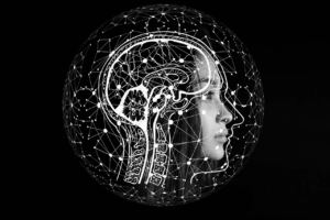 Illustration of a brain made by computer systems interlaced with a woman's face. All in black and white.