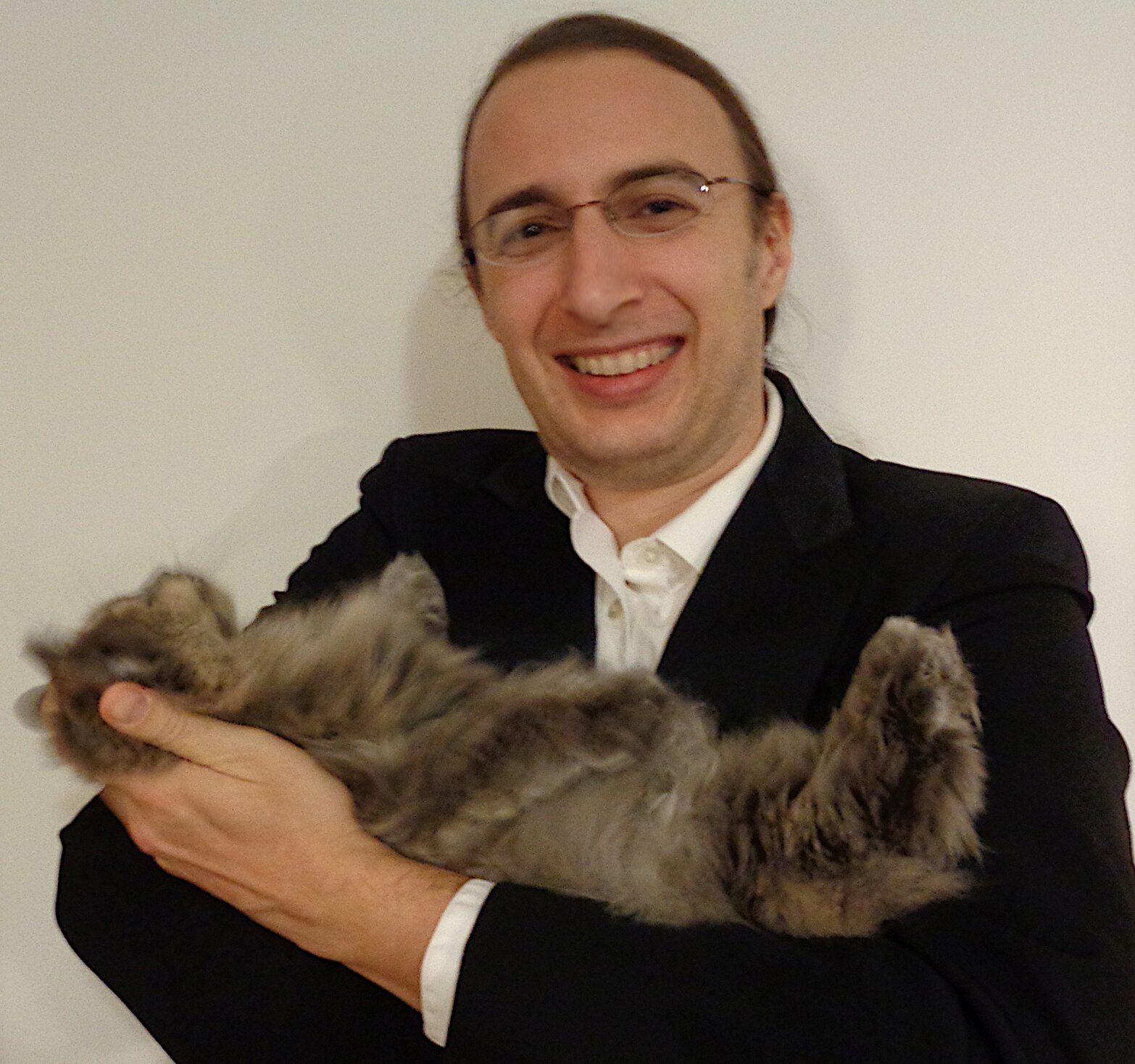 David Mooter holding a cat named Athena.