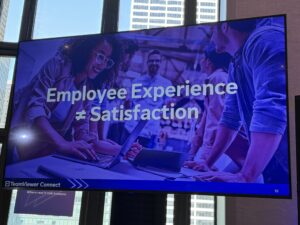 Picture of a sign that says Employee Experience does not equal Satisfaction