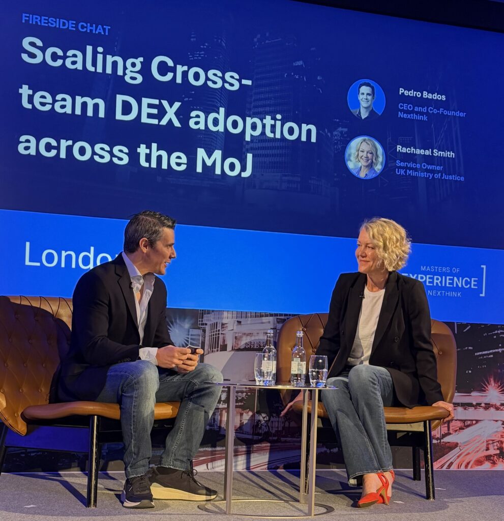 Nexthink CEO Pedro Bados and UK Ministry of Justice Rachael Smith sitting across from one another during a fireside chat presentation.