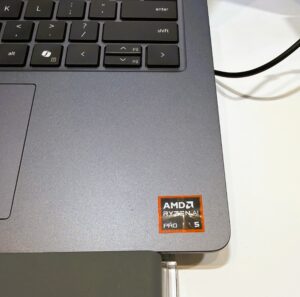 The corner of a laptop computer showing an AMD sticker
